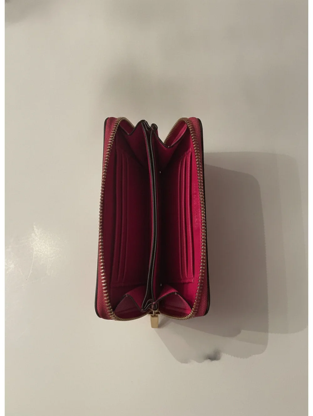 Michael Kors Pink leather zip-around wallet with logo and card slots